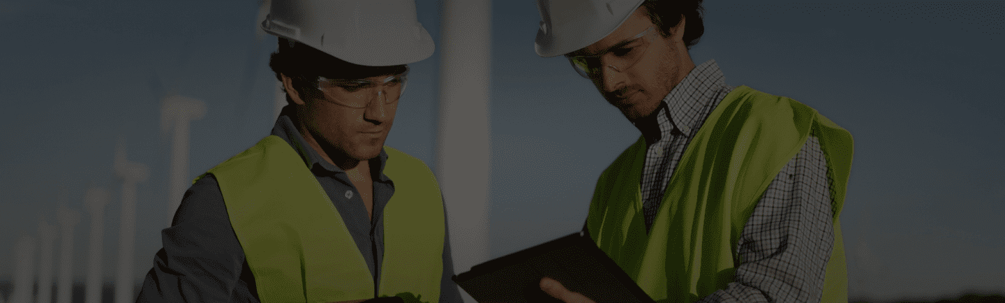Two oil & gas on-site technicians holding FieldLogs Ipad.